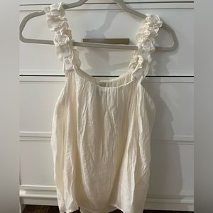 Cream white top with ruffle straps. Size S